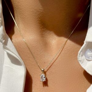 Conjunto de Brinco e Colar Oval com Zircônias Brancas em Banho de Ouro 18k. - Imagem 2